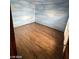 Bedroom features faux-painted sky walls and wood floors at 600 Woodmount Dr, Las Vegas, NV 89107