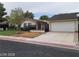 Charming single story home with a two car garage and fenced front yard at 600 Woodmount Dr, Las Vegas, NV 89107