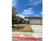 Pleasant single-story home with an attached two-car garage at 600 Woodmount Dr, Las Vegas, NV 89107
