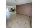 Spacious living room featuring tile flooring, fireplace, and ample natural light at 600 Woodmount Dr, Las Vegas, NV 89107