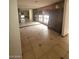 Dining room area with large wall mirror, tiled floor, and wooden hutch at 600 Woodmount Dr, Las Vegas, NV 89107