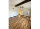 Bright living room featuring wood floors, high ceilings with ceiling fan, and natural light at 600 Woodmount Dr, Las Vegas, NV 89107