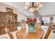 Cozy dining room with an ornate dining set and ample light from adjacent living area at 6143 Basilone Ave, Las Vegas, NV 89122