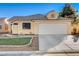 Charming single-story home featuring a tile roof, desert landscaping, and an attached two-car garage at 6143 Basilone Ave, Las Vegas, NV 89122