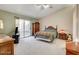 Serene main bedroom with a vaulted ceiling, a sliding glass door, and a spacious layout at 6143 Basilone Ave, Las Vegas, NV 89122