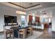 Spacious dining area is perfect for entertaining, flowing into the gourmet kitchen and bar seating at 64 Tapadero Ln, Las Vegas, NV 89135