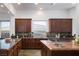 Well-equipped kitchen with abundant counter space, custom cabinets, and high-end fixtures at 64 Tapadero Ln, Las Vegas, NV 89135