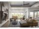 Inviting living room featuring a fireplace, modern decor, and an abundance of natural light at 64 Tapadero Ln, Las Vegas, NV 89135