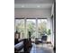 Serene sitting area with large windows, stylish decor, and views of the natural landscape at 64 Tapadero Ln, Las Vegas, NV 89135