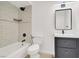 Bathroom with sleek fixtures, white subway tile, and a modern vanity at 6445 Ironbark Ln, Las Vegas, NV 89107