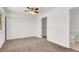 Bedroom boasting a ceiling fan, and easy access to an ensuite bathroom at 6445 Ironbark Ln, Las Vegas, NV 89107
