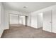 Spacious bedroom with plush carpeting and a large mirrored closet at 6445 Ironbark Ln, Las Vegas, NV 89107