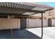 Carport view shows parking spot and building architecture at 6445 Ironbark Ln, Las Vegas, NV 89107