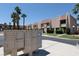 Apartment building exterior, mailboxes, and view of the community neighborhood at 6445 Ironbark Ln, Las Vegas, NV 89107