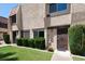 Charming townhome with well-maintained landscaping, grass lawn and cozy front porch at 6445 Ironbark Ln, Las Vegas, NV 89107