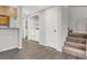 Entryway with hardwood floors, stairs, and convenient laundry room access at 6445 Ironbark Ln, Las Vegas, NV 89107