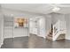 Inviting open-concept living area with tile floors and bright modern color palette at 6445 Ironbark Ln, Las Vegas, NV 89107