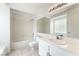 Bathroom featuring a shower-tub combo, tiled walls, and a modern vanity at 6871 Tamarus St # 204, Las Vegas, NV 89119