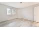 Light and airy bedroom with wood floors and natural light from a window at 6871 Tamarus St # 204, Las Vegas, NV 89119