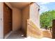 Unit entrance with door number and exterior stairwell at 6871 Tamarus St # 204, Las Vegas, NV 89119