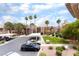 Inviting community with mature landscaping, covered parking, and well-maintained exteriors at 6871 Tamarus St # 204, Las Vegas, NV 89119