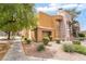 Condominium exterior with well maintained desert landscaping and mature trees at 6871 Tamarus St # 204, Las Vegas, NV 89119