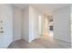 Clean and welcoming entryway with wood floors and neutral walls at 6871 Tamarus St # 204, Las Vegas, NV 89119