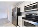 Modern kitchen with stainless steel refrigerator, range, oven, and microwave at 6871 Tamarus St # 204, Las Vegas, NV 89119