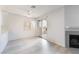 Cozy living room with fireplace and access to balcony with great natural light at 6871 Tamarus St # 204, Las Vegas, NV 89119