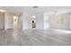 Open floorplan featuring wood floors, neutral walls, and modern ceiling fan at 6871 Tamarus St # 204, Las Vegas, NV 89119