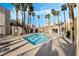 Community pool area, perfect for relaxation and recreation with plenty of lounge chairs at 6871 Tamarus St # 204, Las Vegas, NV 89119