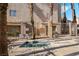 Community hot tub with seating, surrounded by secure fencing and mature palms at 6871 Tamarus St # 204, Las Vegas, NV 89119