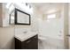 Bathroom with a single sink vanity, mirror, and combined tub and shower at 7400 W Flamingo Rd # 1082, Las Vegas, NV 89147