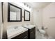 Bathroom featuring double sinks, modern fixtures, and a sleek vanity design at 7400 W Flamingo Rd # 1082, Las Vegas, NV 89147