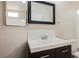 Bathroom with a single sink vanity, mirror, and toilet at 7400 W Flamingo Rd # 1082, Las Vegas, NV 89147