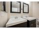 Modern bathroom featuring dual sinks with dark wood cabinets and framed mirrors at 7400 W Flamingo Rd # 1082, Las Vegas, NV 89147