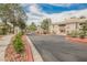 Gated community entrance with well-maintained landscaping, ensuring privacy and security at 7400 W Flamingo Rd # 1082, Las Vegas, NV 89147