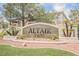Attractive community entrance with lush landscaping, showcasing the Altair community sign at 7400 W Flamingo Rd # 1082, Las Vegas, NV 89147