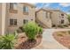 Attractive condo building with well-kept grounds, showcasing walkways and vibrant plants at 7400 W Flamingo Rd # 1082, Las Vegas, NV 89147