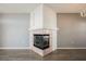 Close-up of the living room fireplace with decorative tile and a wood mantle at 7400 W Flamingo Rd # 1082, Las Vegas, NV 89147