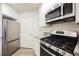 Functional kitchen featuring stainless steel appliances, white cabinets, and modern design at 7400 W Flamingo Rd # 1082, Las Vegas, NV 89147