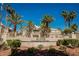 Exterior view of community signage with lush palm trees and well-maintained landscaping, showcasing a welcoming entrance at 7400 W Flamingo Rd # 1082, Las Vegas, NV 89147