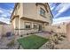 Backyard features patio pavers, low maintenance landscaping and privacy fence at 7915 Pandora Sky St # 402, North Las Vegas, NV 89084