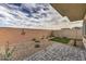 Fenced backyard area with patio pavers and low maintenance landscaping at 7915 Pandora Sky St # 402, North Las Vegas, NV 89084