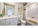 Bathroom features a vanity with sink, toilet, and a shower tub combo at 7915 Pandora Sky St # 402, North Las Vegas, NV 89084