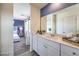 Bathroom with white cabinets, quartz countertop and open to the bedroom at 7915 Pandora Sky St # 402, North Las Vegas, NV 89084