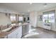 Bright kitchen features stainless steel appliances, modern cabinetry, and an open layout at 7915 Pandora Sky St # 402, North Las Vegas, NV 89084
