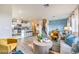 Open-concept living space combining a stylish living area with kitchen featuring stainless appliances and dining room at 7915 Pandora Sky St # 402, North Las Vegas, NV 89084