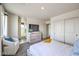 Serene main bedroom with ensuite bathroom, plush carpet, and abundant natural light at 7915 Pandora Sky St # 402, North Las Vegas, NV 89084