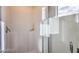Modern bathroom features a glass-enclosed shower with sleek fixtures at 7915 Pandora Sky St # 402, North Las Vegas, NV 89084